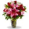 FLORERO CON STARGAZER Y 12 ROSAS ROJAS.